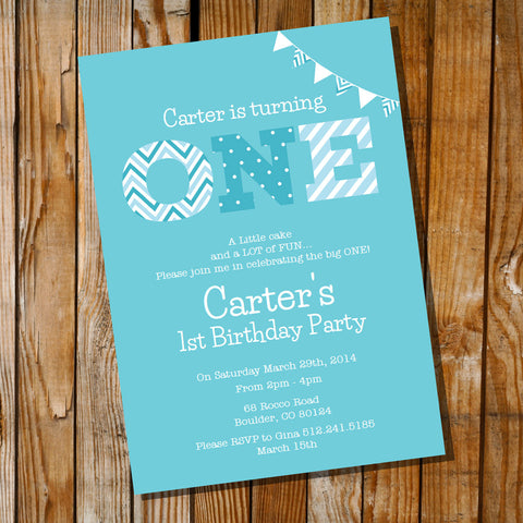 blue first birthday invitation for a boy with the word ONE.